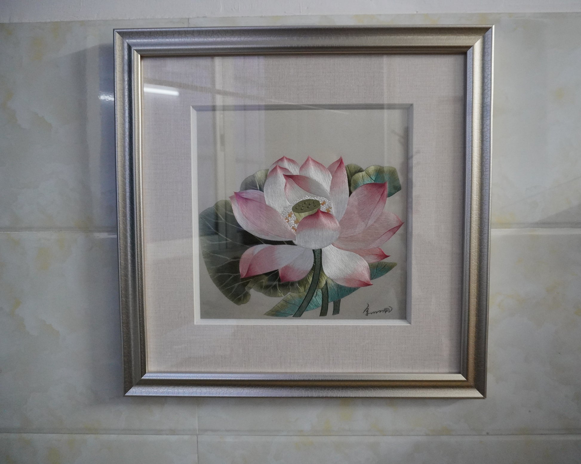 Canton embroidery of Song Dynasty lotus painting. Hand-embroidered silk art in silver frame, 50.5cm square with glass.