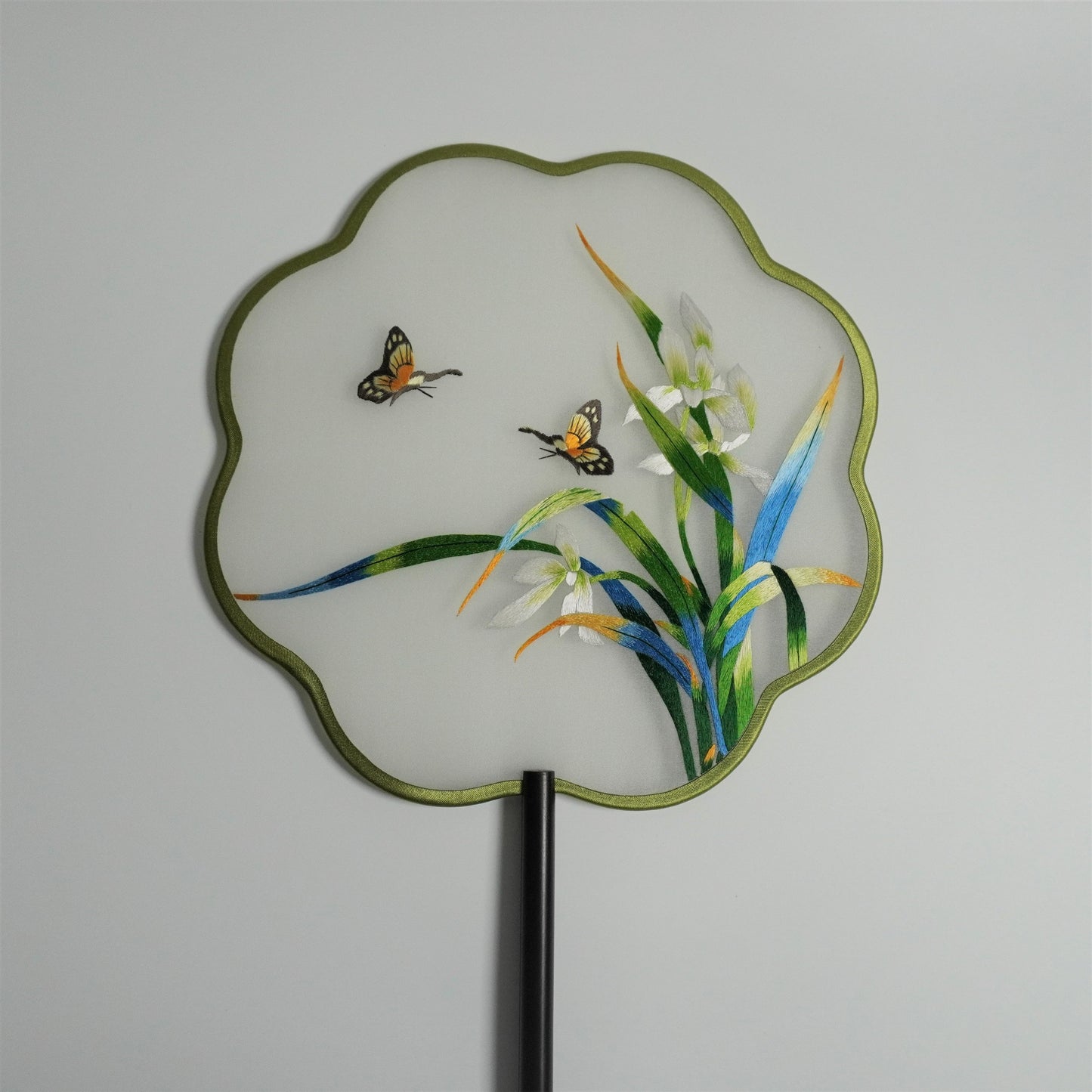 Hand-embroidered orchid and butterfly on silk gauze fan with plum blossom shaped frame.