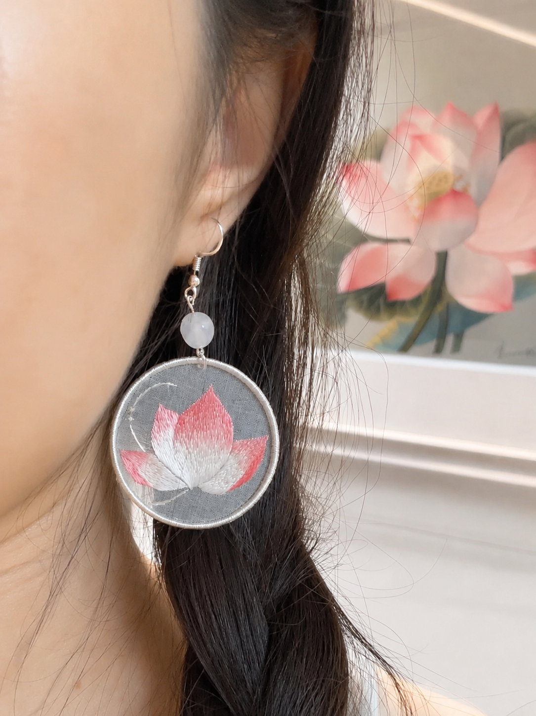 Handmade lotus earrings worn on ears, lifestyle modeling shot