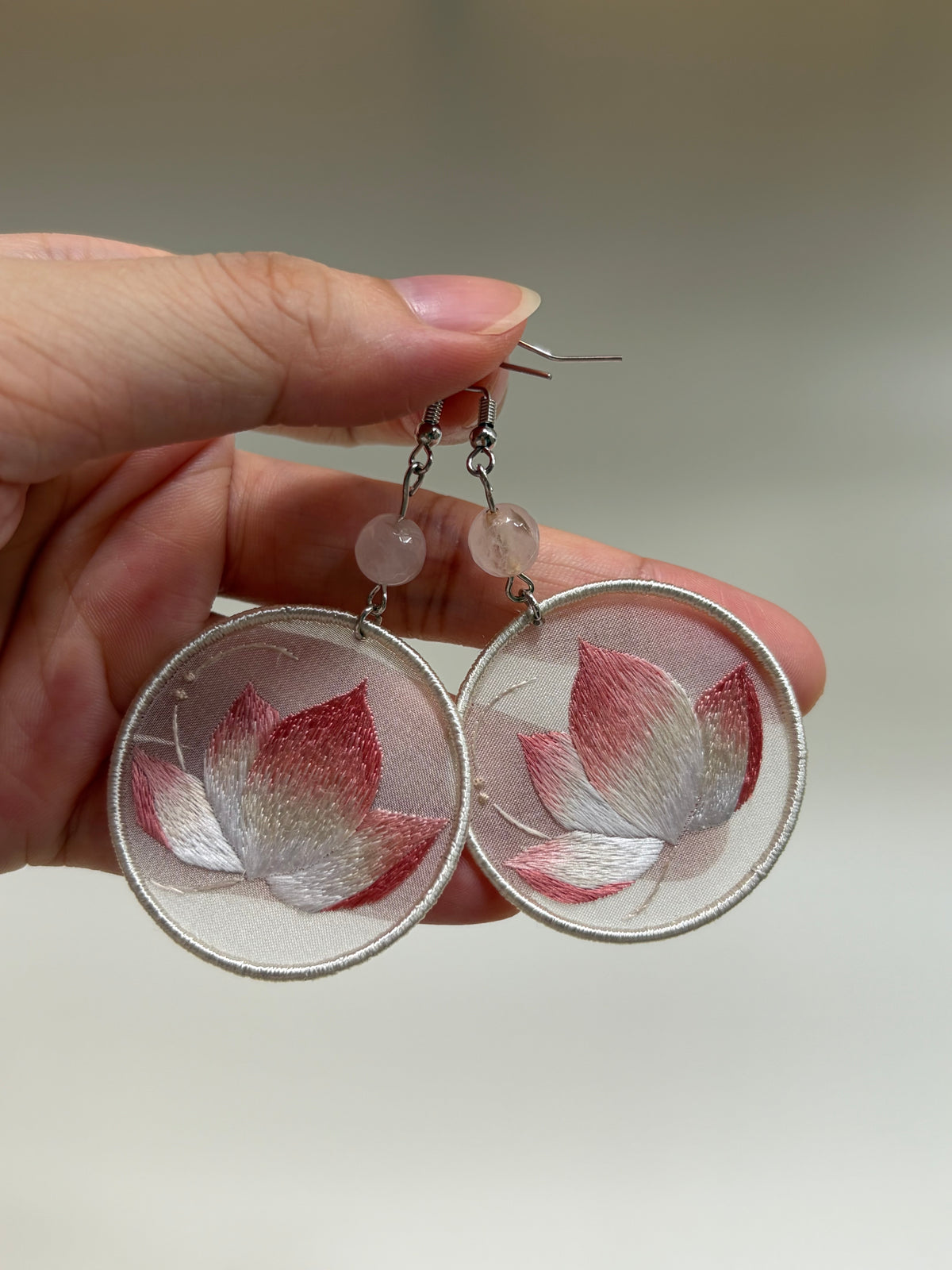 Hand-embroidered earrings with natural silk thread