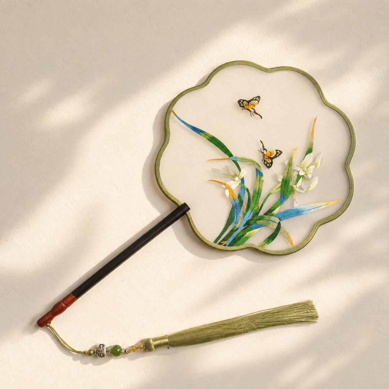 Petal shaped handmade double sided embroidered fan with tassel